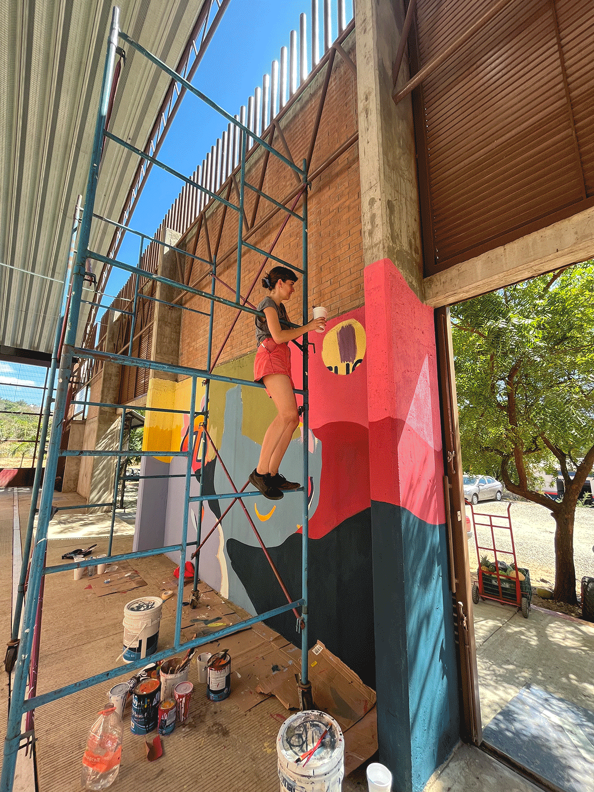 video of progress of mural painting on wall 