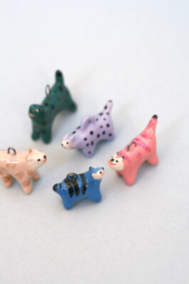 Handmade ceramic cat charms in colorful designs by Anja Bartelt 